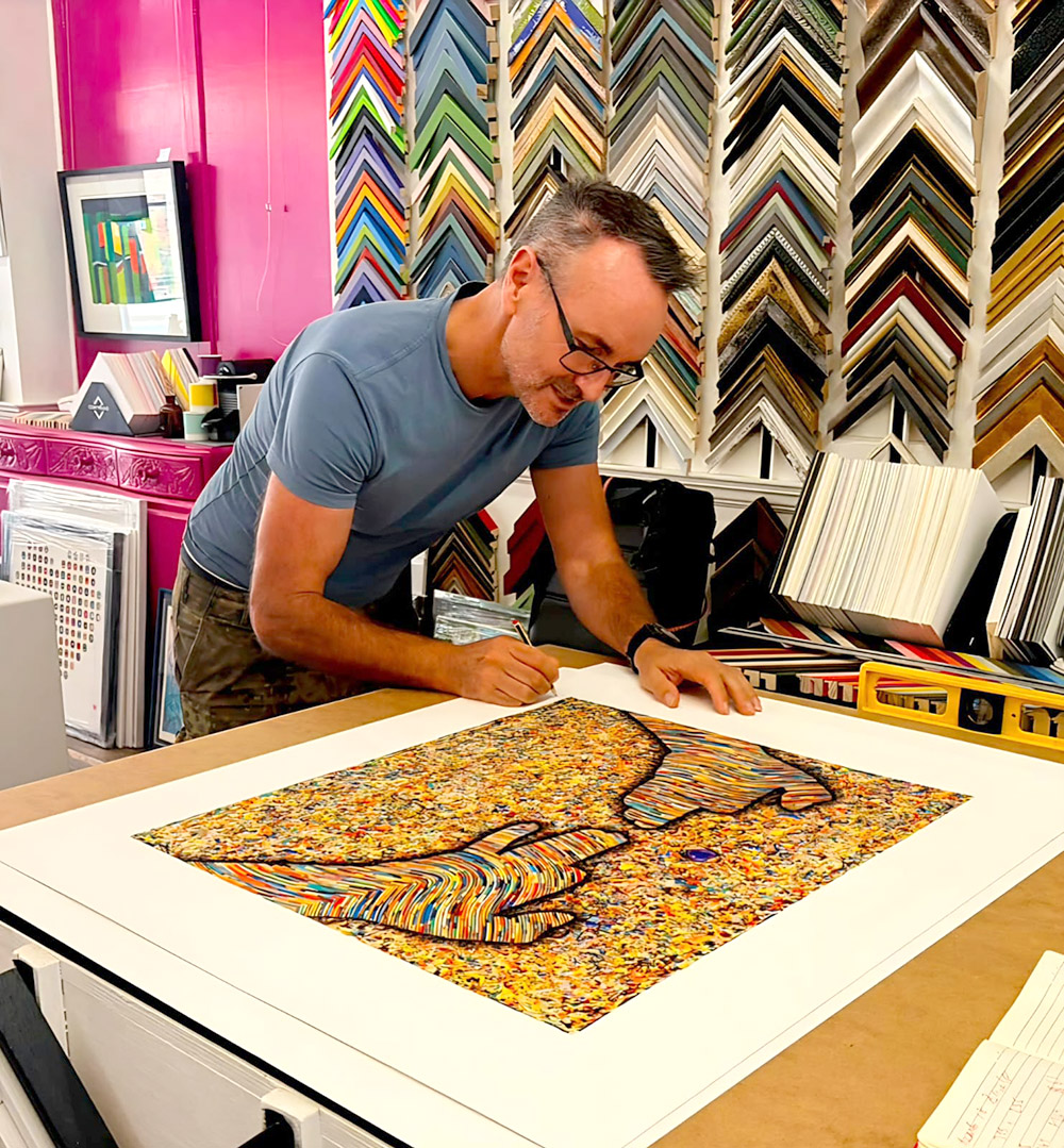 Stephen Farley signing a Hands of Love print